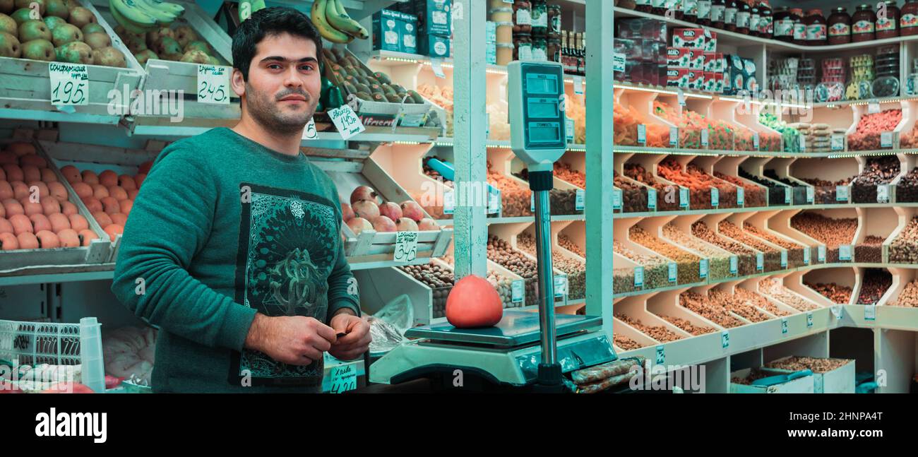 21st of December 2019, Russia, Tomsk, salesman in food kiosk Stock Photo