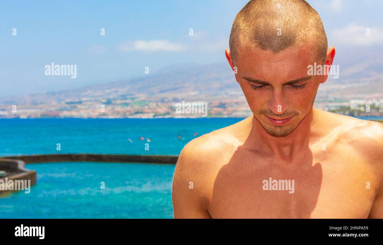 Young male model at Playa de las Americas Tenerife Africa. Stock Photo