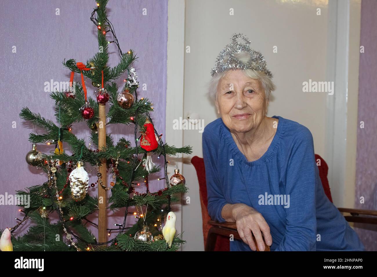 Happy mature woman christmas tree hi-res stock photography and images ...