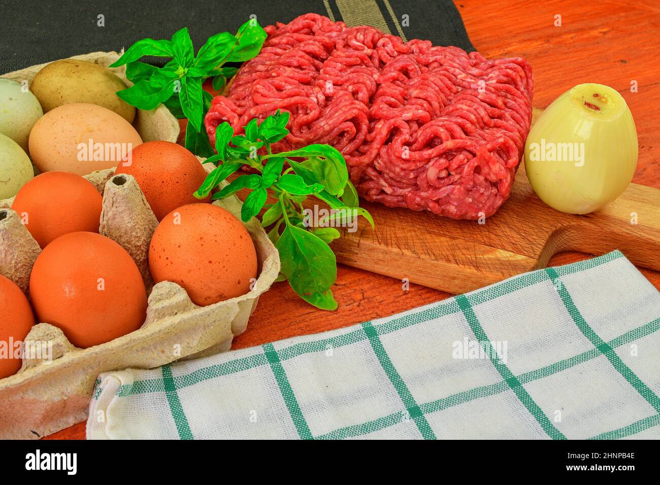 Mince. Ground meat with ingredients for cooking. Mixed minced meat ready to making burgers, fatty's, meaetballs. Food photography. Culinary concept. Minced meat recipe Stock Photo