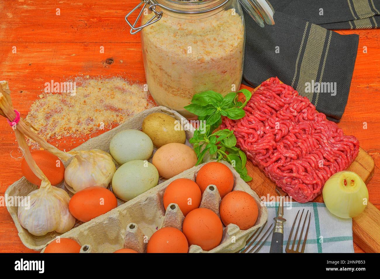 Mince. Ground meat with ingredients for cooking. Mixed minced meat ready to making burgers, fatty's, meaetballs. Food photography. Culinary concept. Minced meat recipe Stock Photo