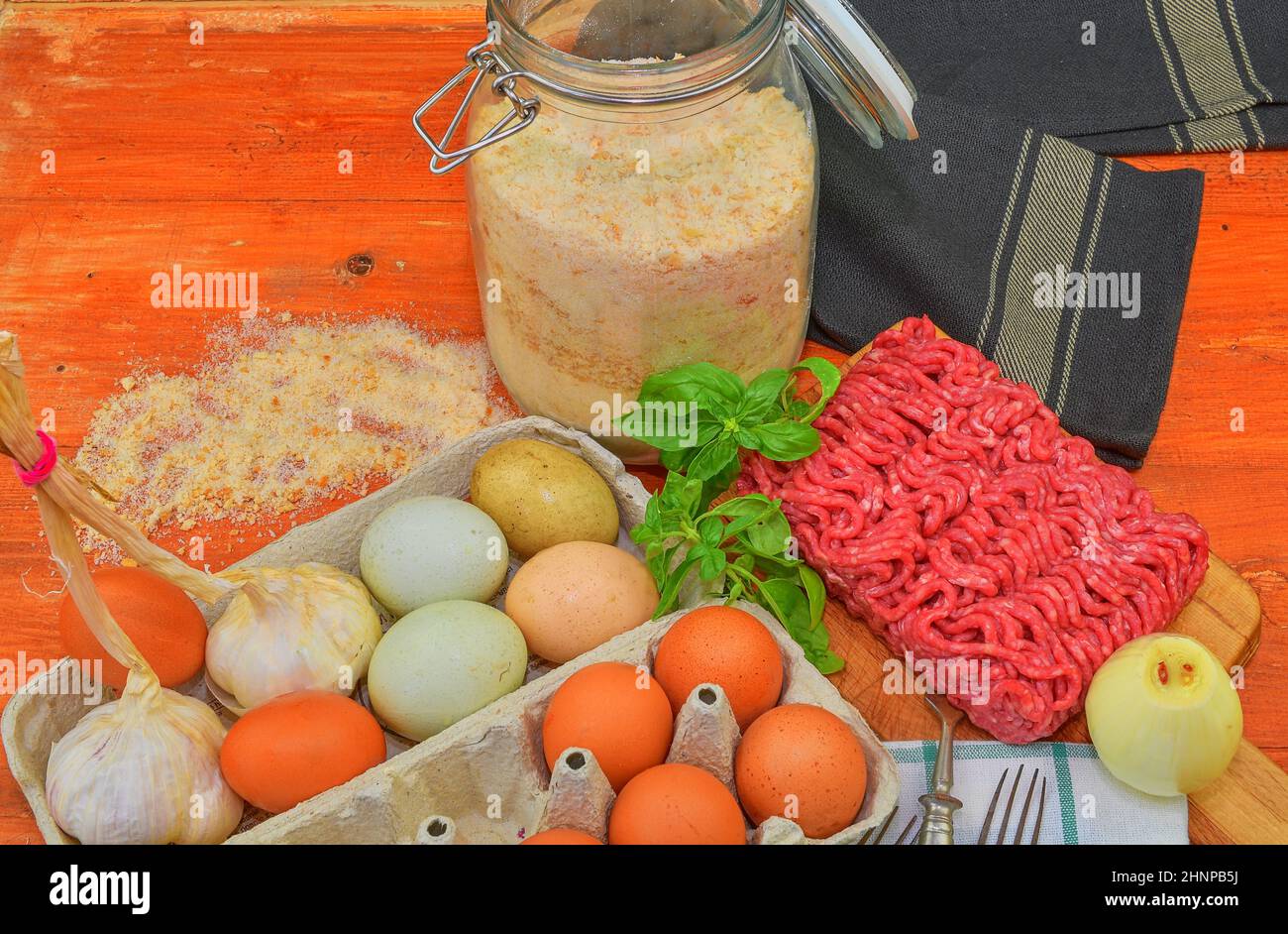 Mince. Ground meat with ingredients for cooking. Mixed minced meat ready to making burgers, fatty's, meaetballs. Food photography. Culinary concept. Minced meat recipe Stock Photo