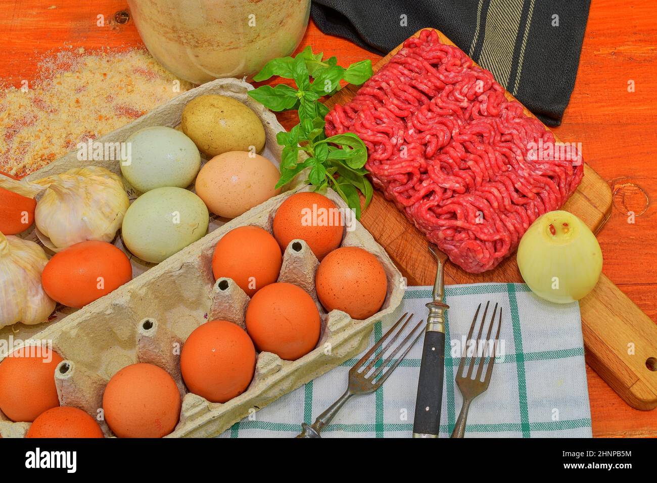 Mince. Ground meat with ingredients for cooking. Mixed minced meat ready to making burgers, fatty's, meaetballs. Food photography. Culinary concept. Minced meat recipe Stock Photo