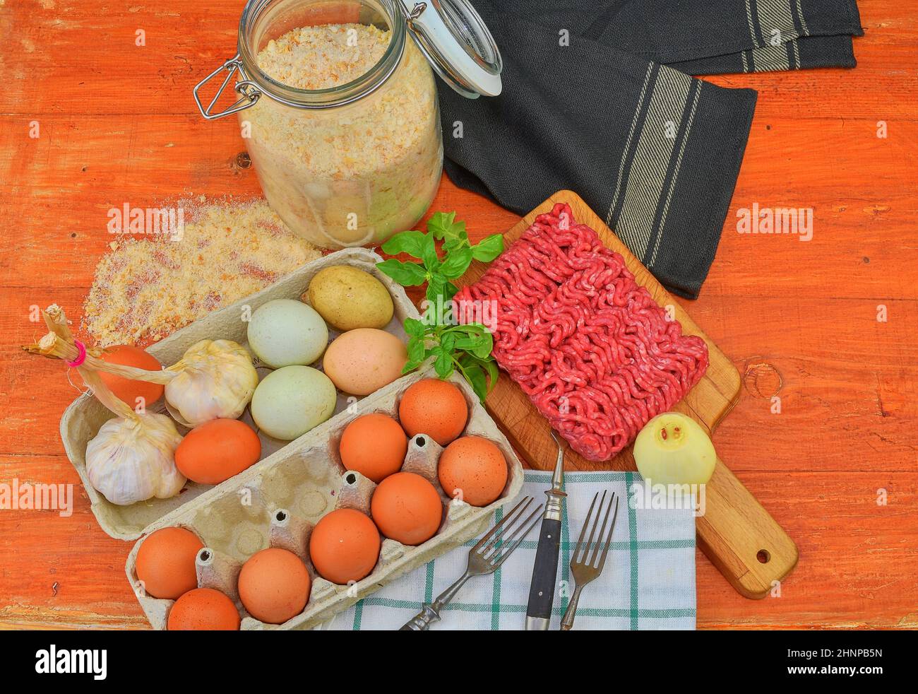 Mince. Ground meat with ingredients for cooking. Mixed minced meat ready to making burgers, fatty's, meaetballs. Food photography. Culinary concept. Minced meat recipe Stock Photo