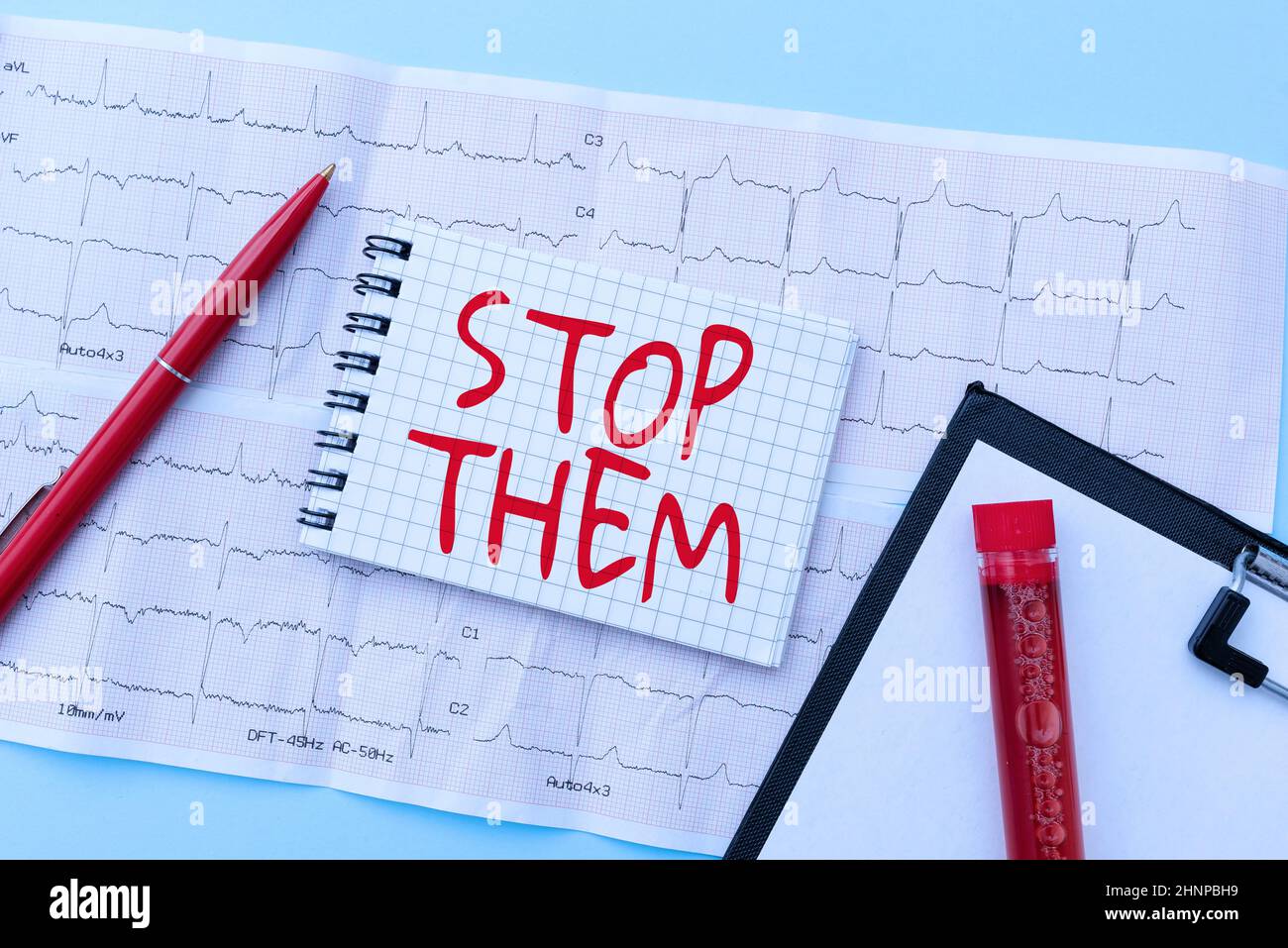 Text sign showing Stop Them. Word for used for telling someone not to do something that they are doing Reading Graph And Writing Important Medical Notes Test Result Analysis Stock Photo
