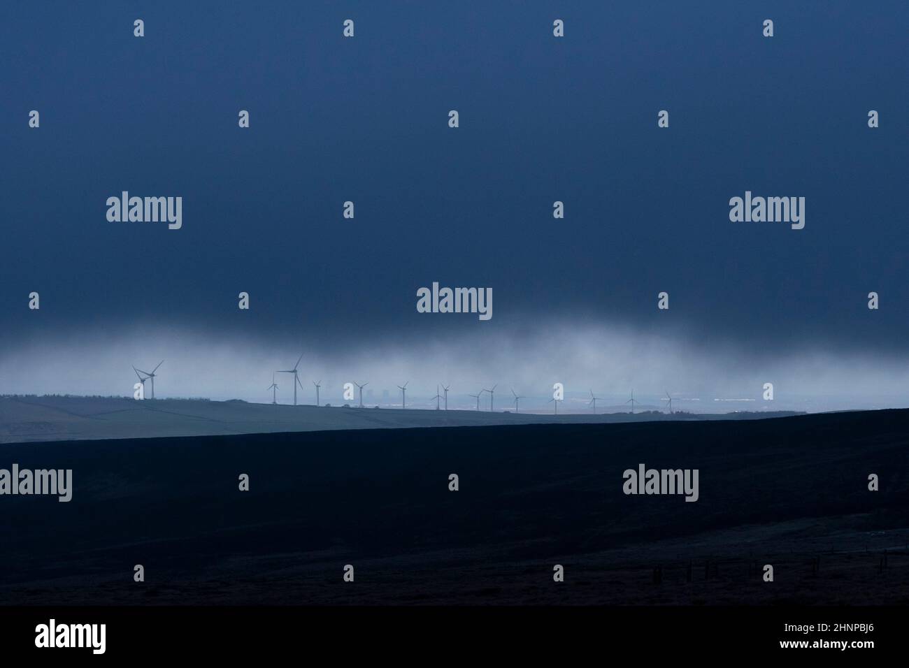 Glossop, UK, 17th Feb. 2022. Wind turbines are seen in Derbyshire as a rare red weather warning for coastal parts of south Wales and south-west England is issued by the Met Office before what could be the worst storm to hit the UK in 30 years. Storm Eunice is expected to arrive at 5am on Friday, bringing potentially dangerous weather for much of the country, Derbyshire, UK. Credit: Jon Super/Alamy Live News. Stock Photo