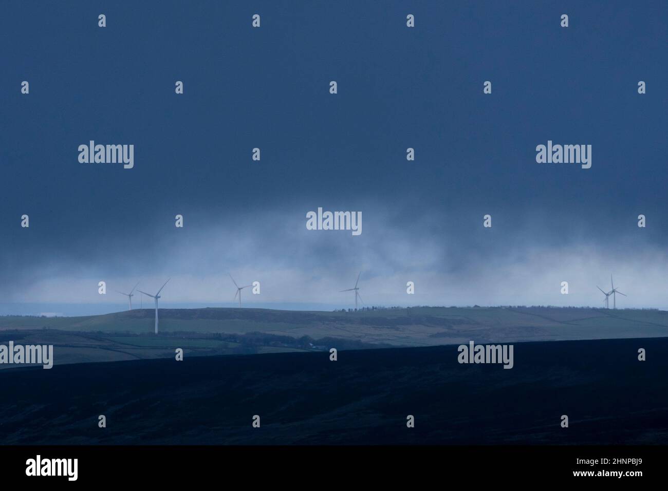 Glossop, UK, 17th Feb. 2022. Wind turbines are seen in Derbyshire as a rare red weather warning for coastal parts of south Wales and south-west England is issued by the Met Office before what could be the worst storm to hit the UK in 30 years. Storm Eunice is expected to arrive at 5am on Friday, bringing potentially dangerous weather for much of the country, Derbyshire, UK. Credit: Jon Super/Alamy Live News. Stock Photo