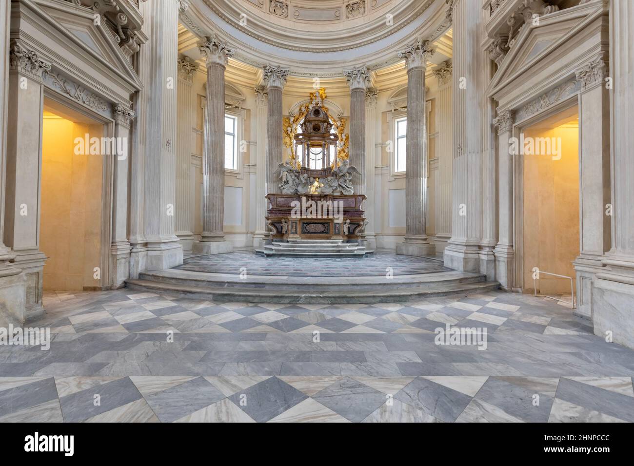 Sacred catholic altar in Baroque style and cupola. Day light - Italy Stock Photo