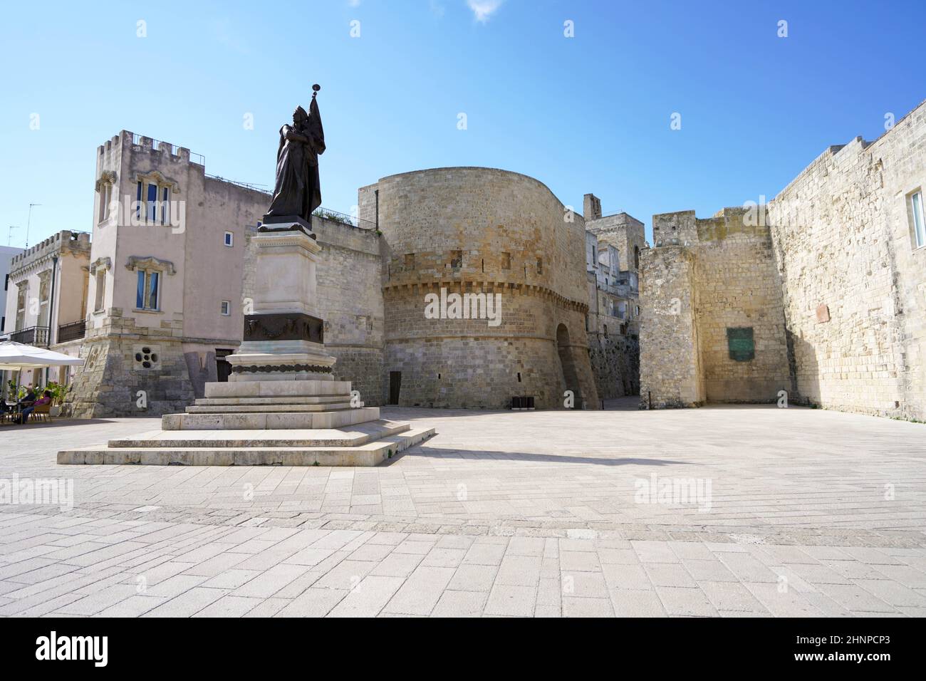 Lungomare degli Eroi with monument on promenade with Torre Alfonsina tower in Otranto, Italy Stock Photo