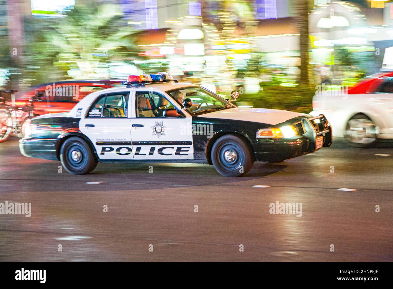 police hurry with police car by night at the strip in Las Vegas Stock Photo