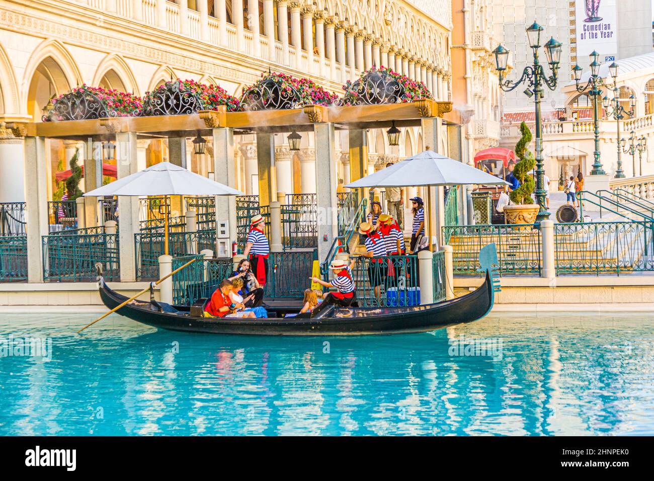 gondola with tourists at The Venetian Resort Hotel & Casino The resort opened  1999 with flutter of white doves, sounding trumpets and singing gondoliers Stock Photo