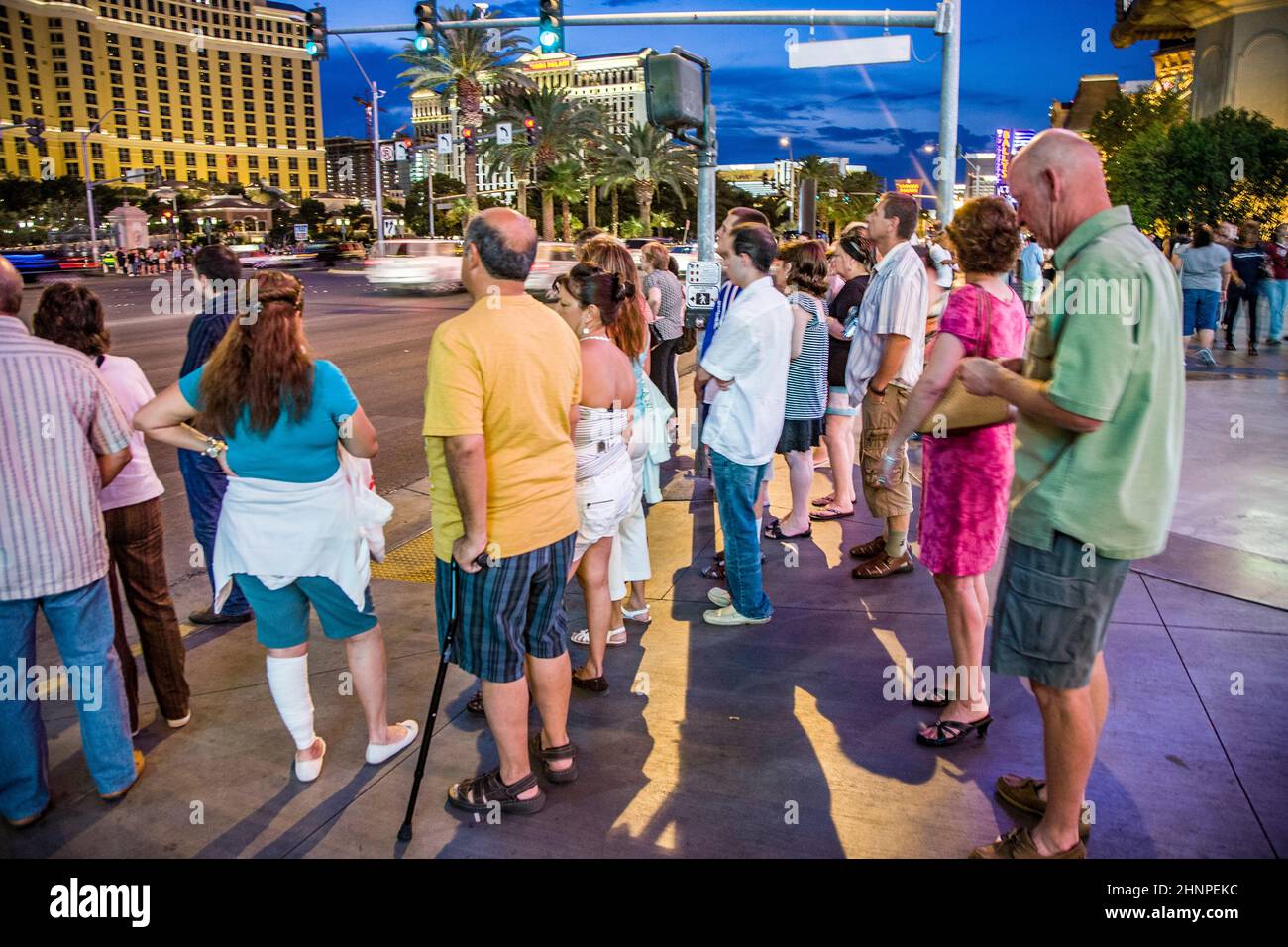 pedestrians wait at the Strip in Las Vegas for green light to cross the street. Stock Photo
