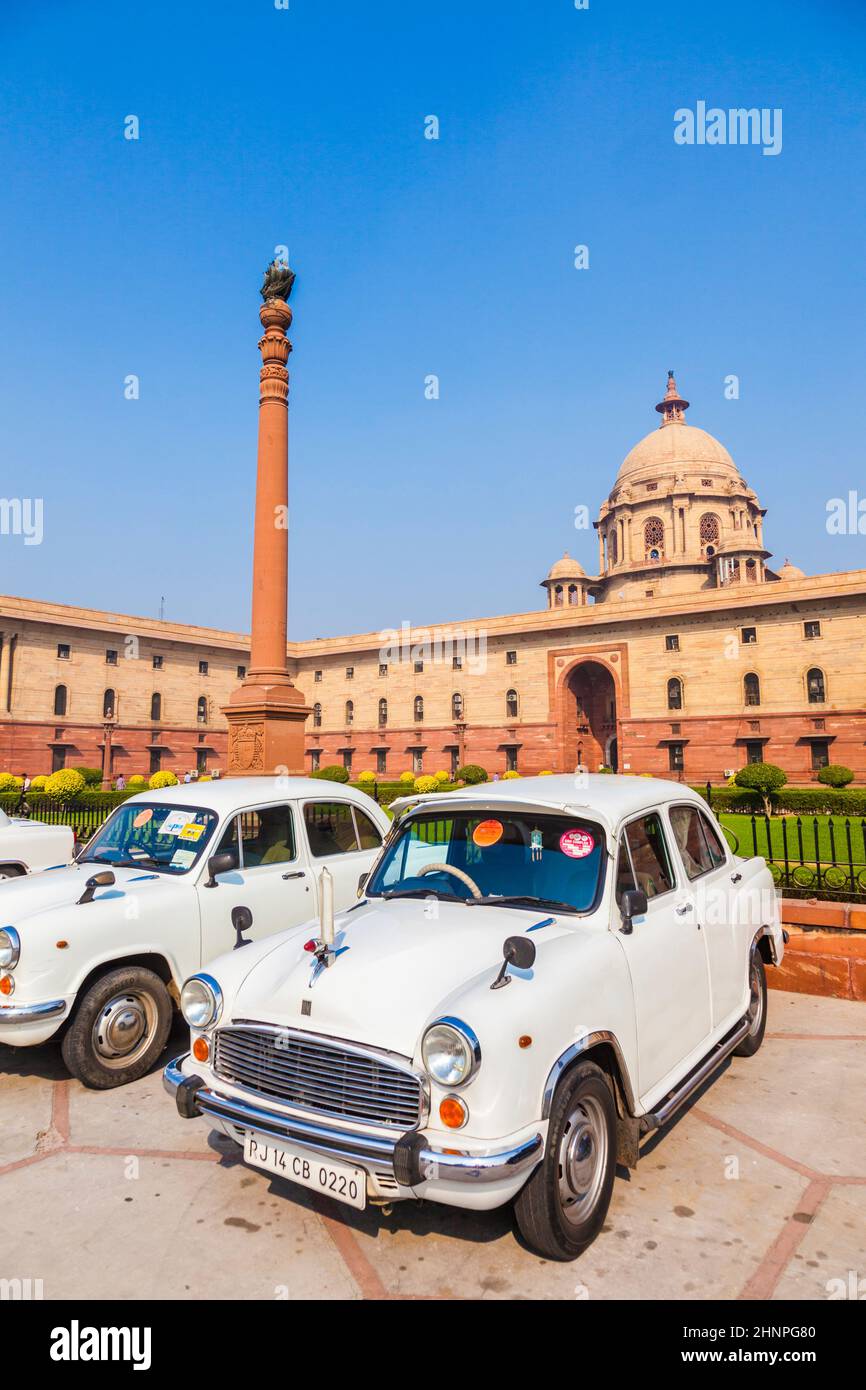 Official Hindustan Ambassador cars park outside North Block, Secretariat Building in Delhi, India Stock Photo