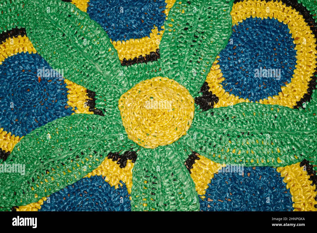 Rug from recycled material. recycled textiles used to make colorful