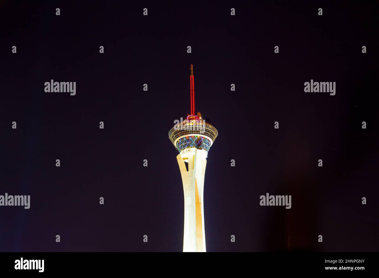 Night lights of the Sahara Casino and Stratosphere Tower invites vacationers to play in the casino and try luck Stock Photo