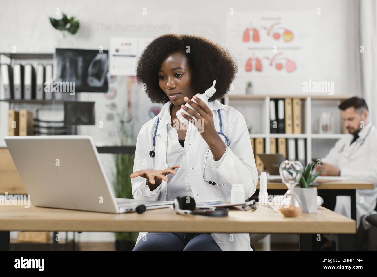Qualified Female Doctor In White Lab Coat Making Online Consultation 