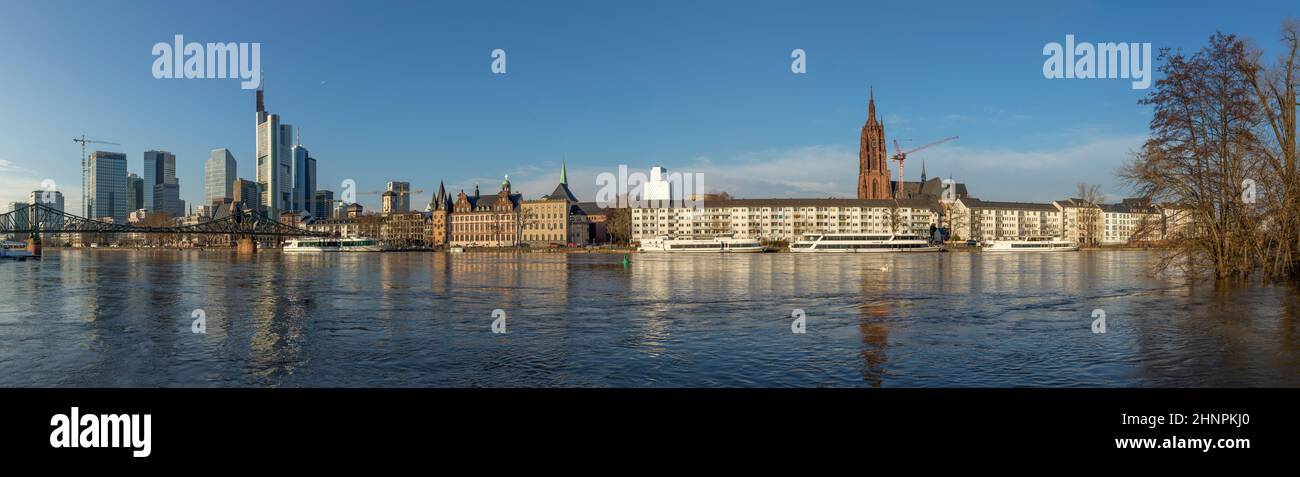 panoramic view to skyline of Frankfurt am Main, Germany with high water at river Main Stock Photo