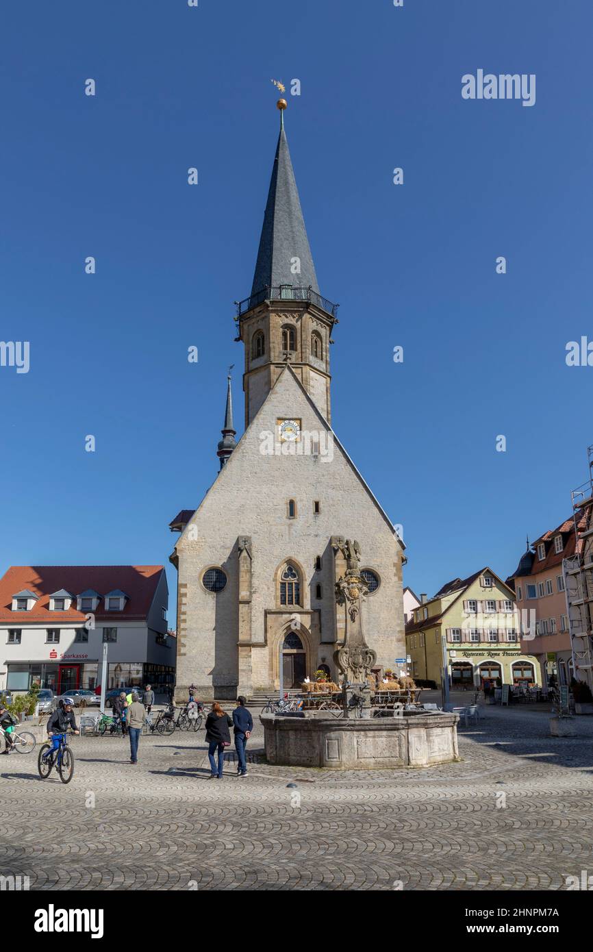 tourists relax at the town central square of Weikersheim along the romantic road Stock Photo