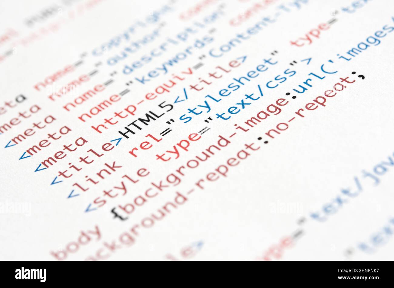 HTML script printed on white paper with shallow depth of field Stock Photo