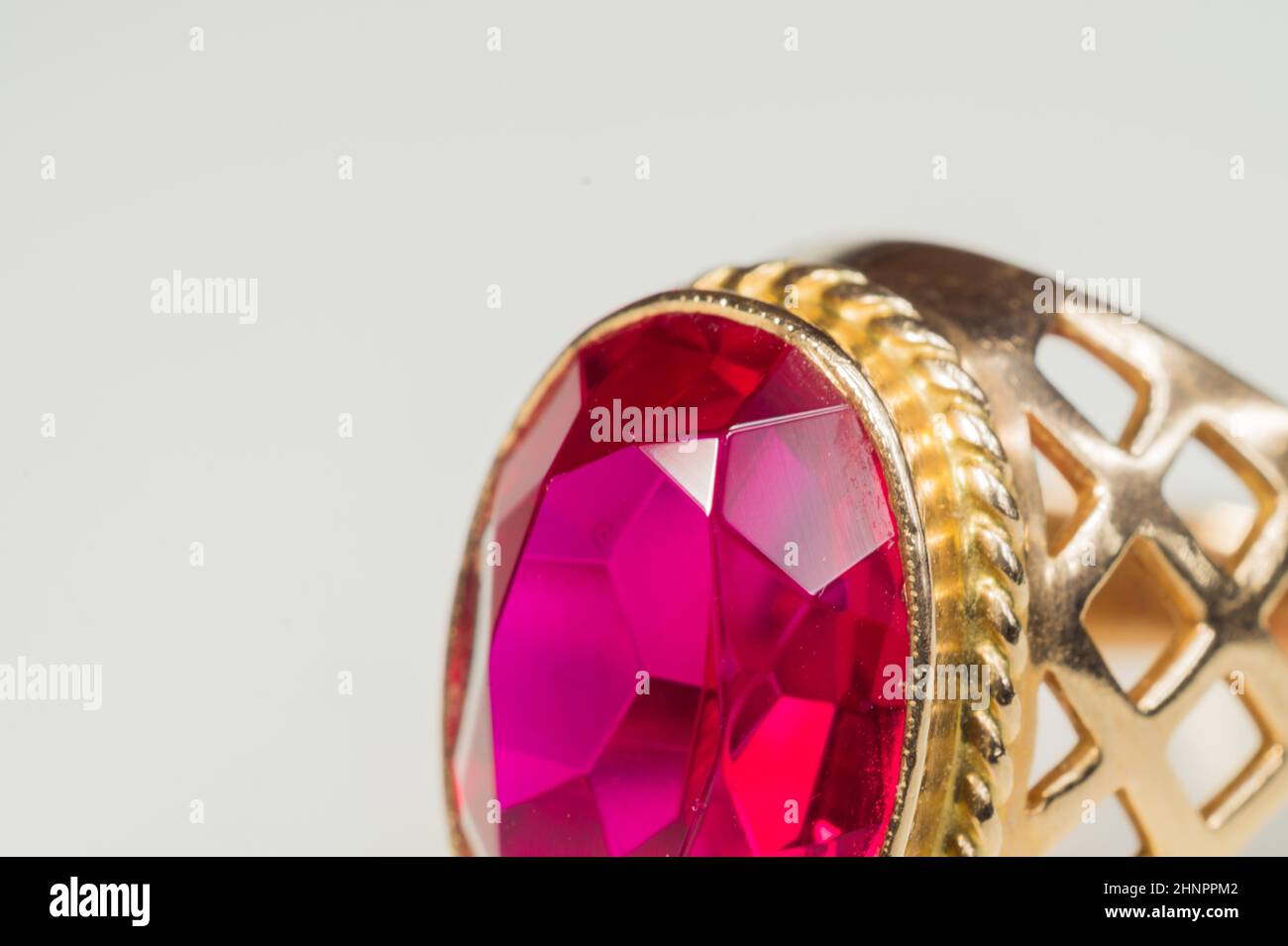 Golden ring with ruby isolated on white background Stock Photo