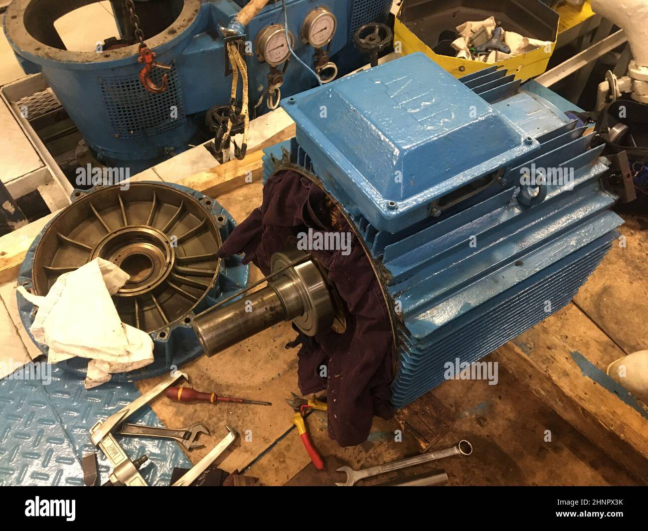 ships crew doing electrical motor repair,bearing replacement of
