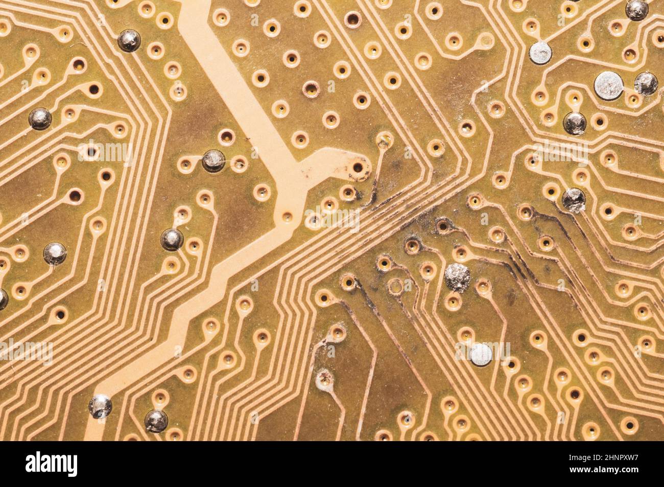 Burnt circuit board abstract background. spoiled motherboard close up