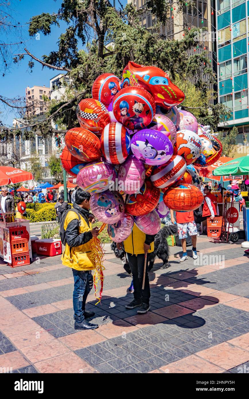 man sells balloons filled with gas for children in La Paz Stock Photo
