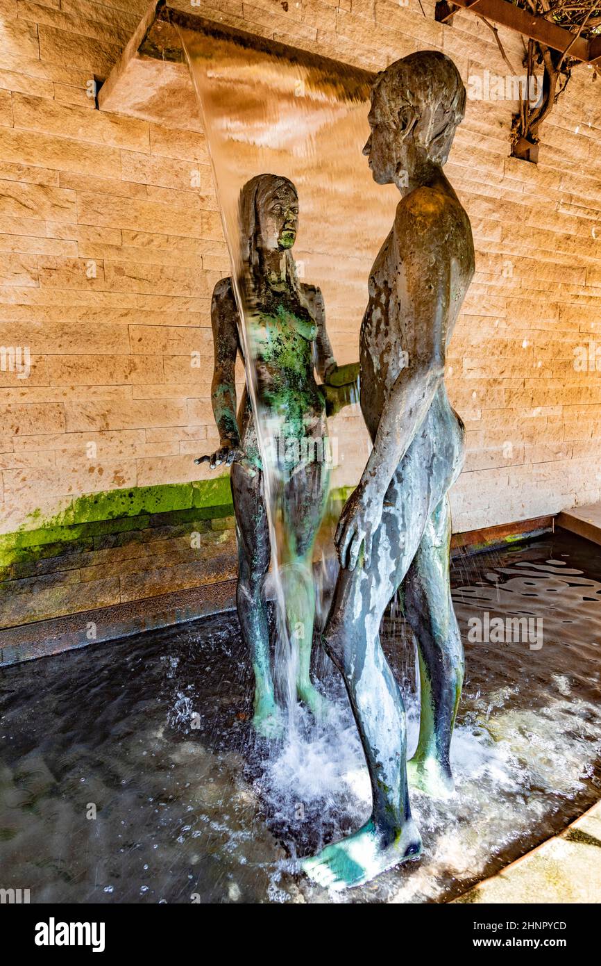 garden of love with scenic statue of man and woman in love located in, Die Gaerten von Schloss Trauttmansdorff, South Tyrol Stock Photo