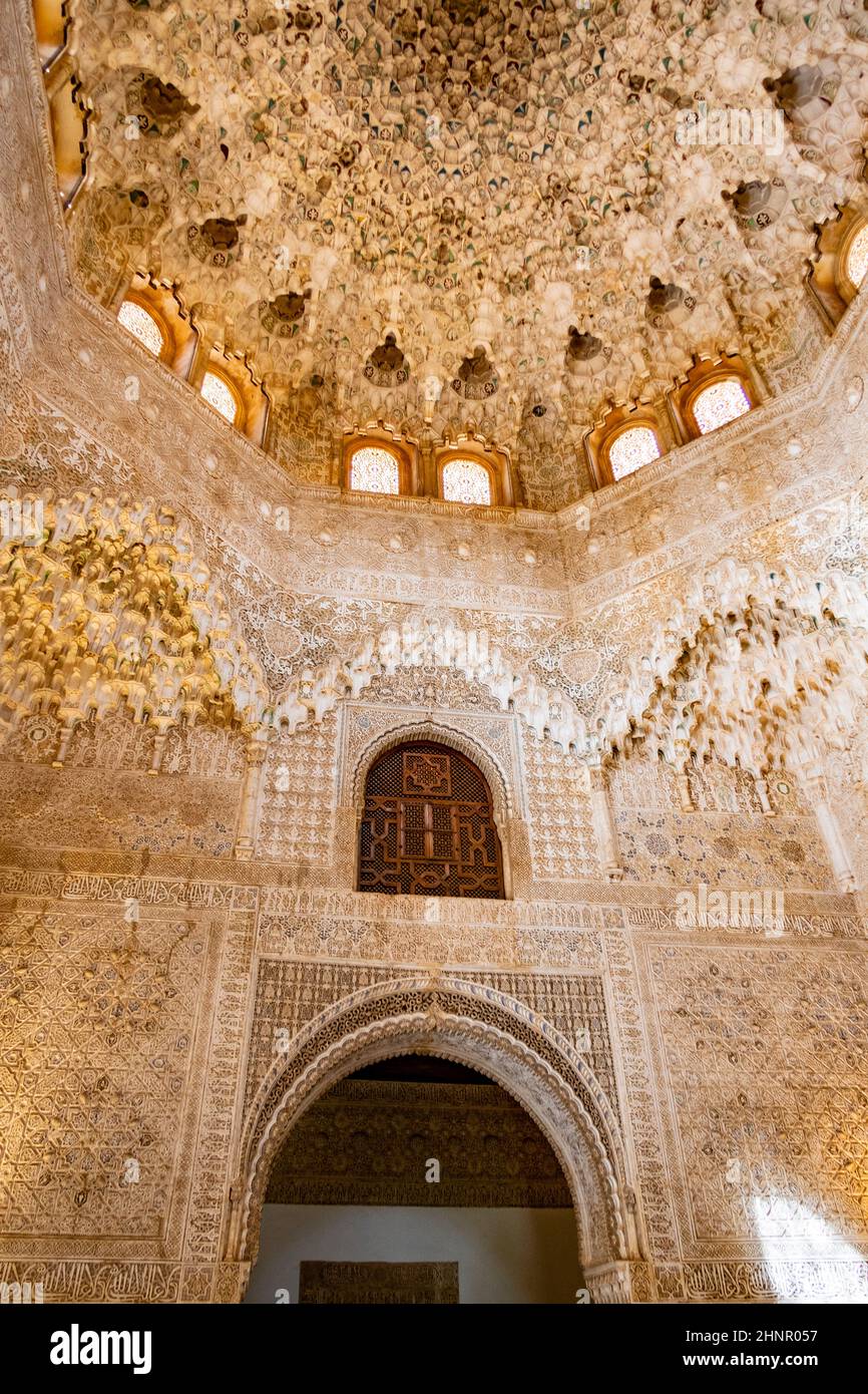 The ancient pattern on the ceiling and wall. decorated inside Reales Alcazares de Sevilla from Nasrid dynasty era Stock Photo