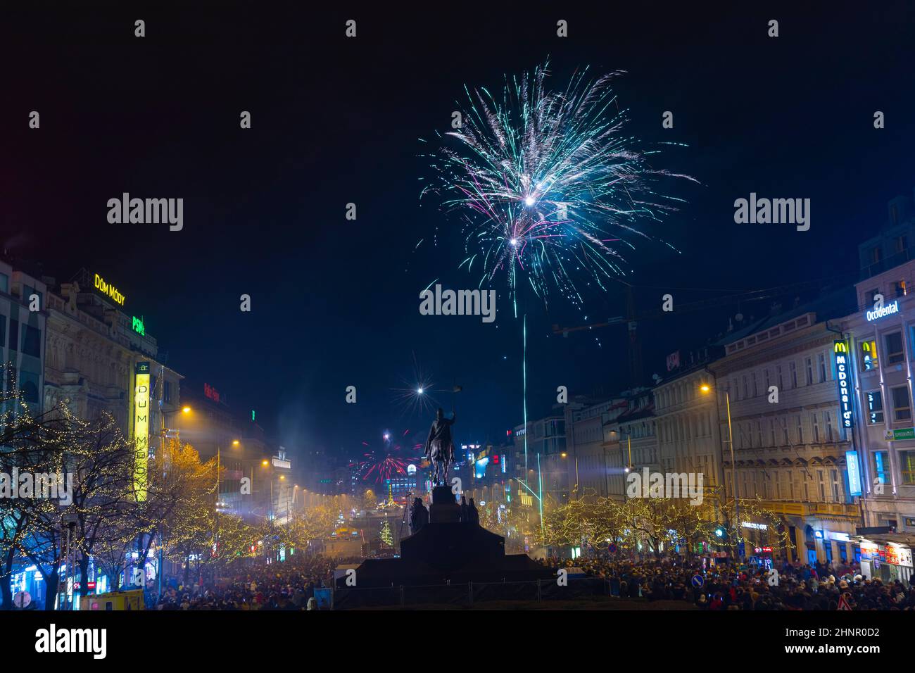 Large celebration of the New year 2019 on the main Prague square, the Wenceslas square. Hundreds of people were lunching fireworks and throwing firecrackers Stock Photo