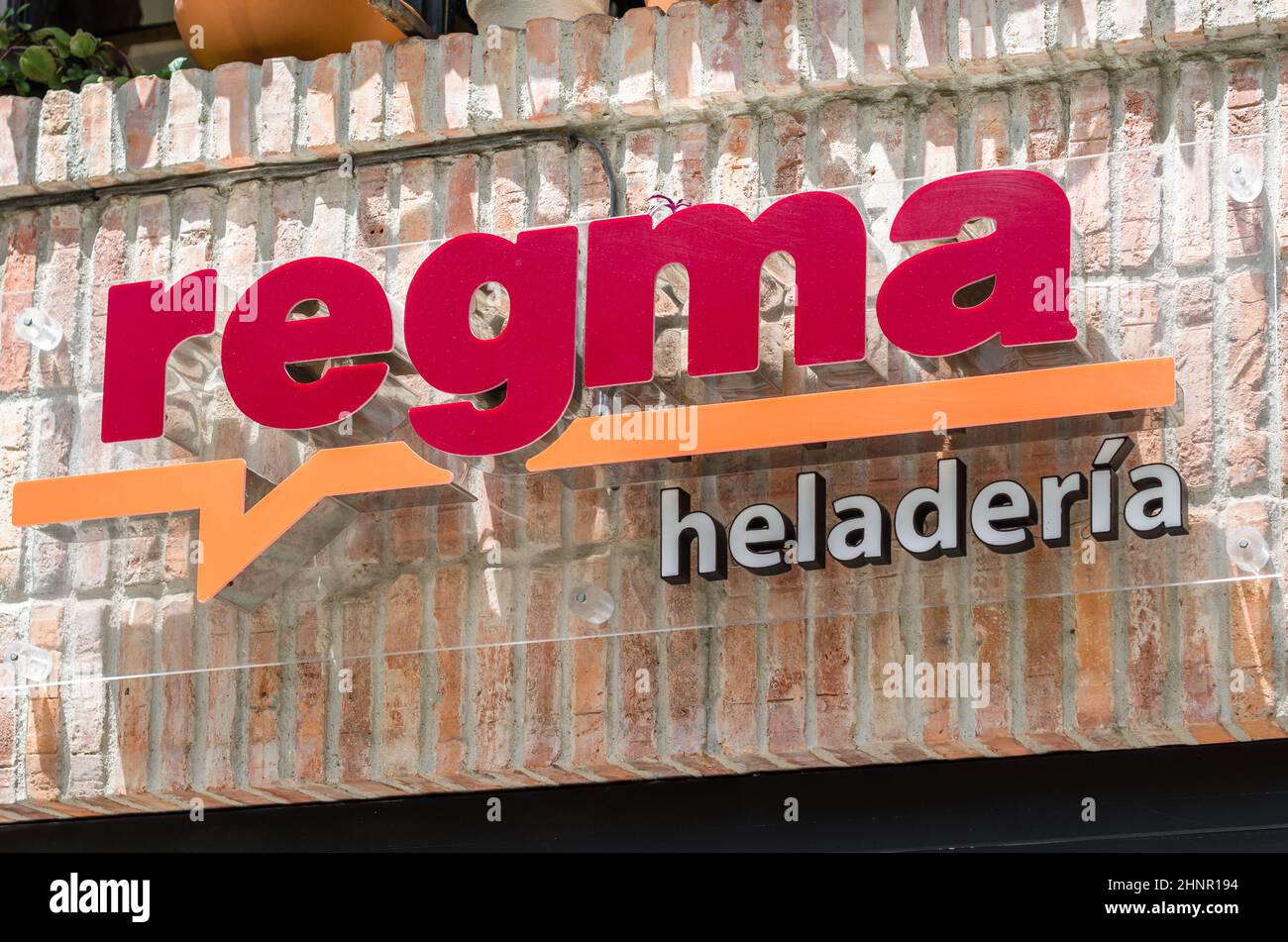 SANTANDER, SPAIN - JULY 11, 2021: Logo of the Regma ice cream shop in one of its stores in Santander, Spain. Regma ice cream shop, founded in Santander in 1933, is famous in northern Spain Stock Photo