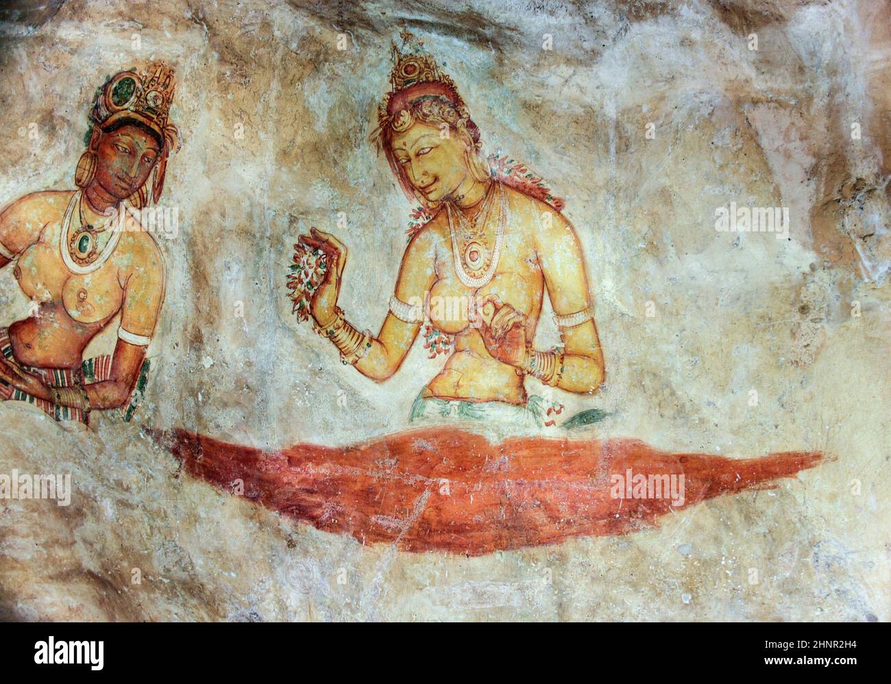 Sigiriya maiden - 5th century frescoes at the ancient rock fortress Stock Photo