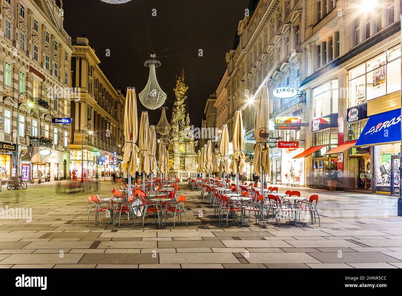 famous Graben street at night with rain reflection on the cobbles Stock Photo