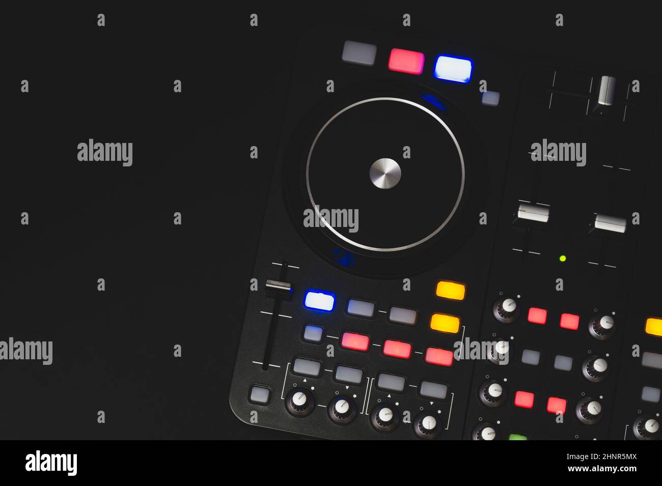Dj sound mixer controller with knobs and sliders close up. audio mixing