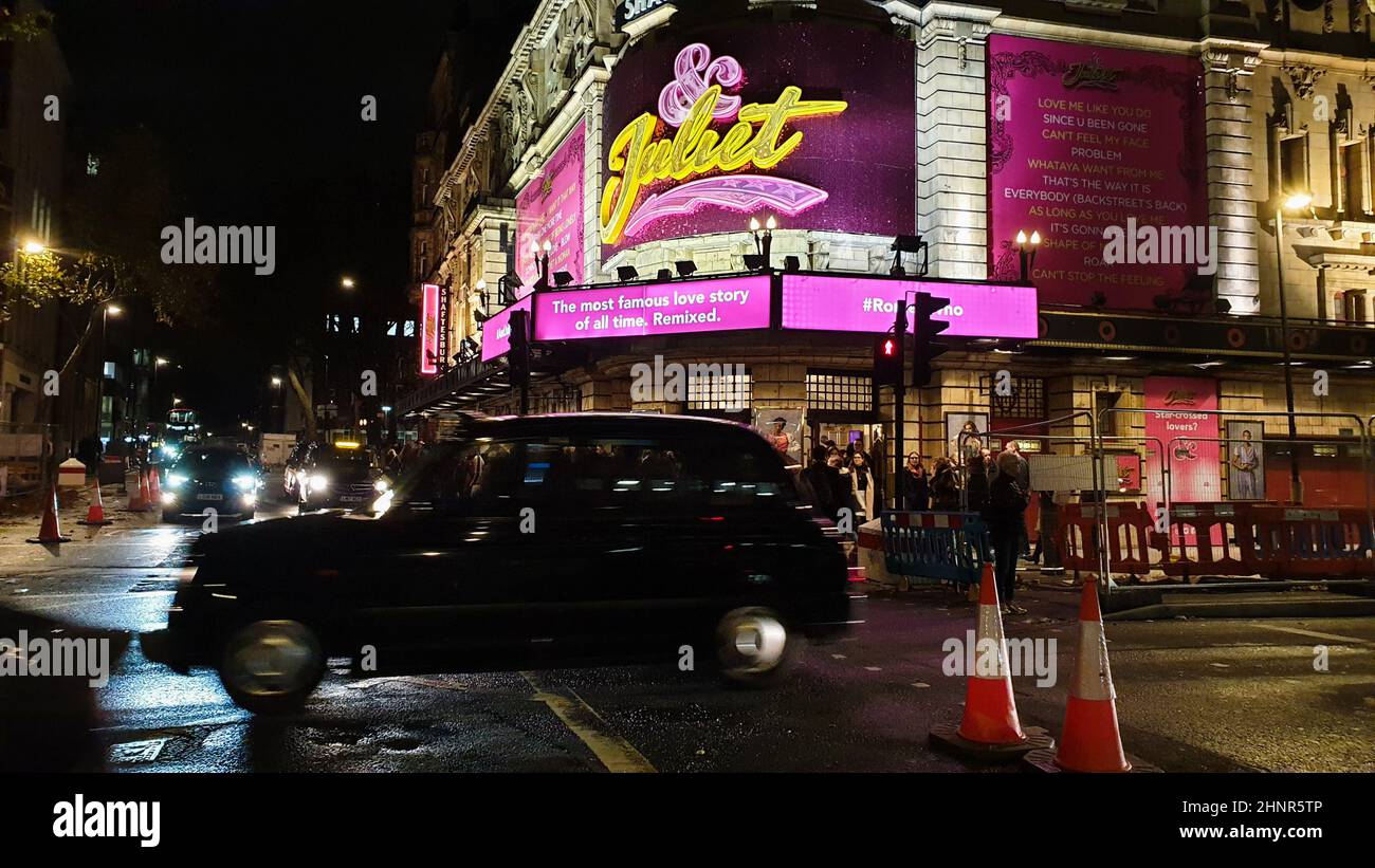 London, UK - 11.05.2019: '& Juliet' musical play neon sign at night. People leaving Shaftesbury theatre after the show. London culture and entertain Stock Photo
