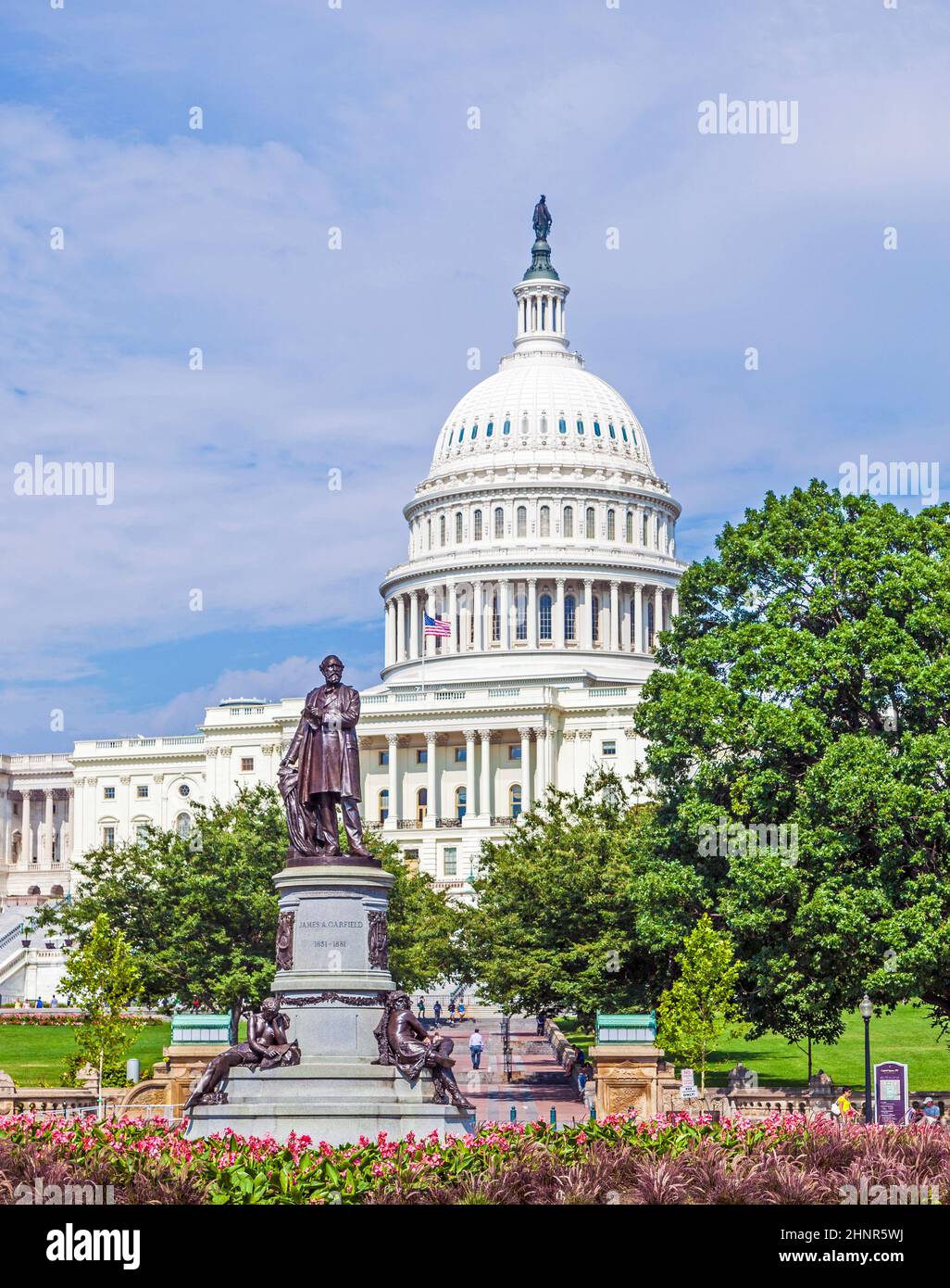 people visit the Capitol in Washington with the statue of James