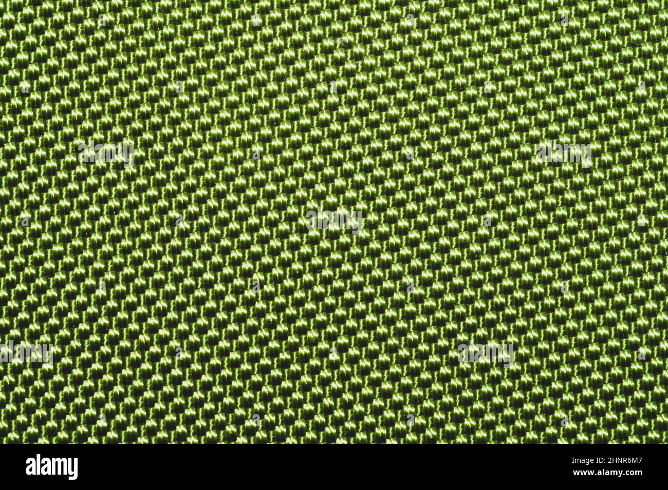 Synthetic fabric texture close up. green braided surface. woven ...