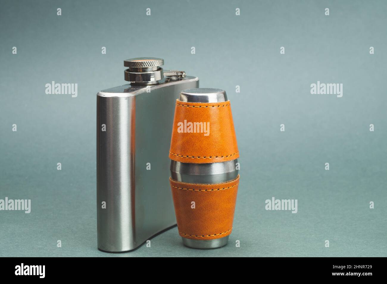 Stainless steel flask with pair of shot glasses. travel shot glass for