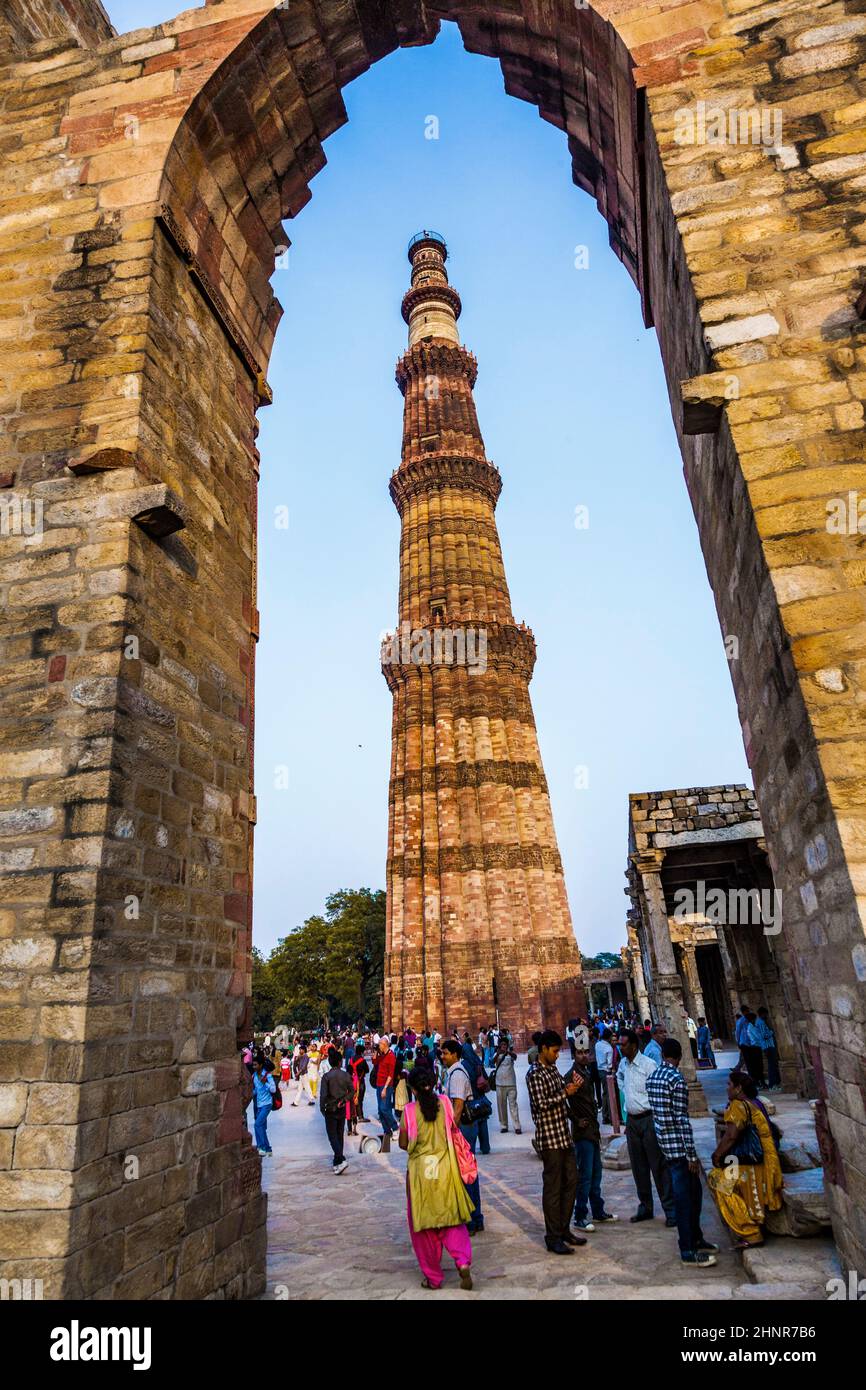 people visit Qutb Minar, Delhi, the worlds tallest brick built minaret Stock Photo