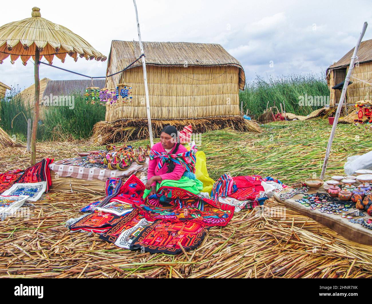 Local women in traditional attire work sell handicrafts Stock Photo