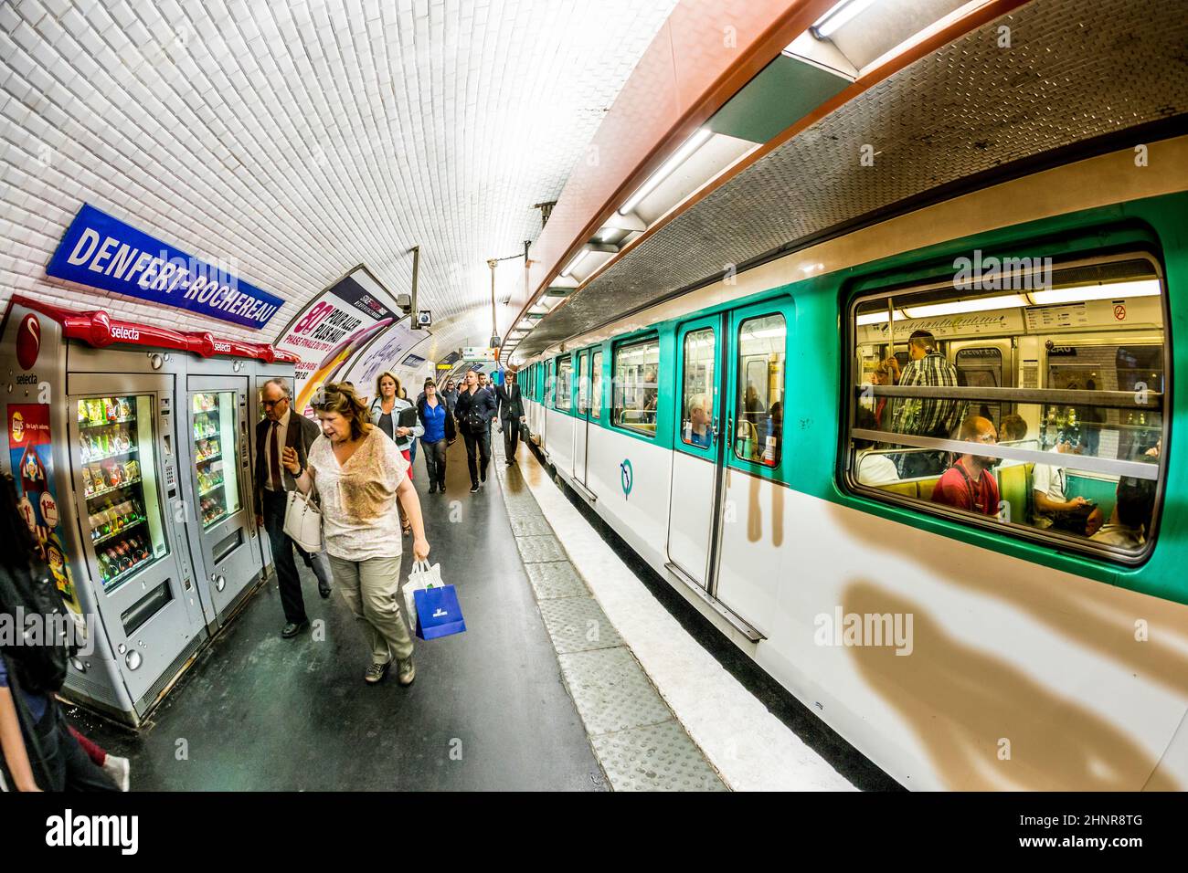 Tourists and locals on a subway train in Paris Stock Photo