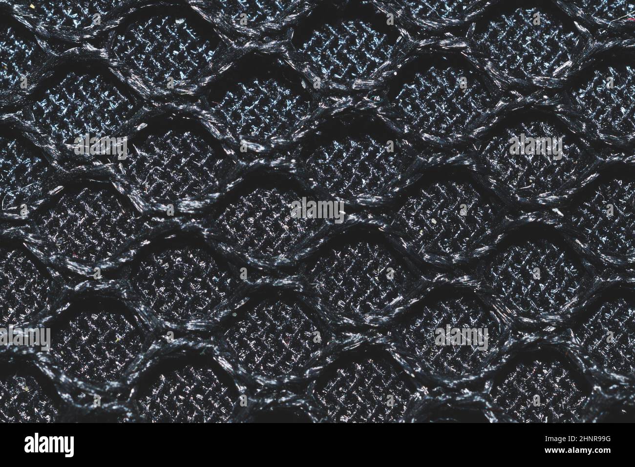 Black fabric texture close up. knitted pattern. woven material. textile