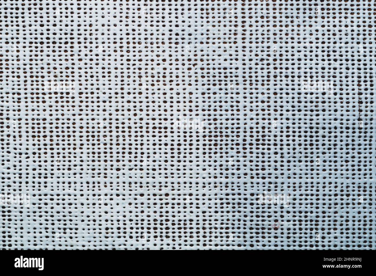 Rubber surface with uneven holes. white plastic texture with dots. abstract background Stock Photo
