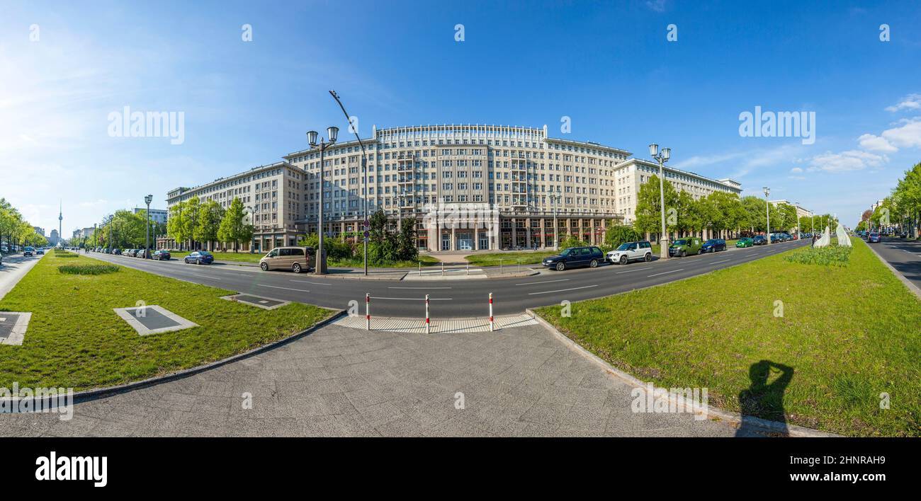 Facades of old socialist GDR era apartment buildings on Karl Marx Allee in former East Berlin Germany Stock Photo