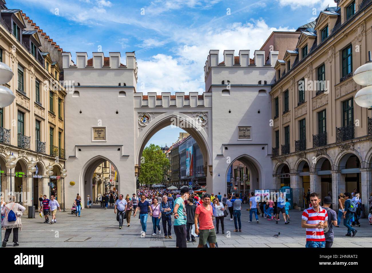 People walking along through the Karlstor gate in Munich Stock Photo