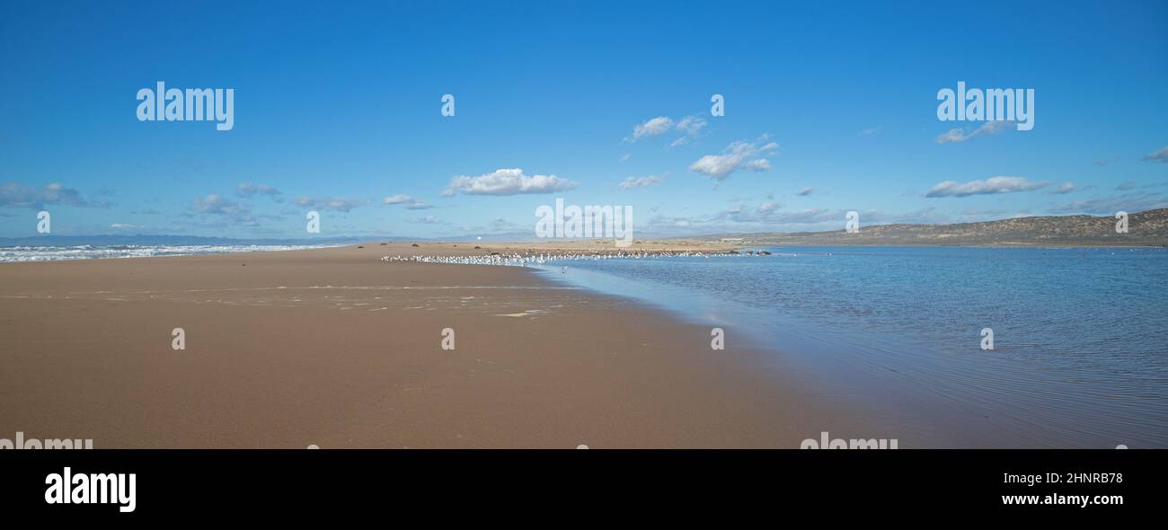 Peninsula of sand between Pacific ocean and the Santa Maria river at the Rancho Guadalupe Sand Dunes Preserve on the central coast of California Unite Stock Photo