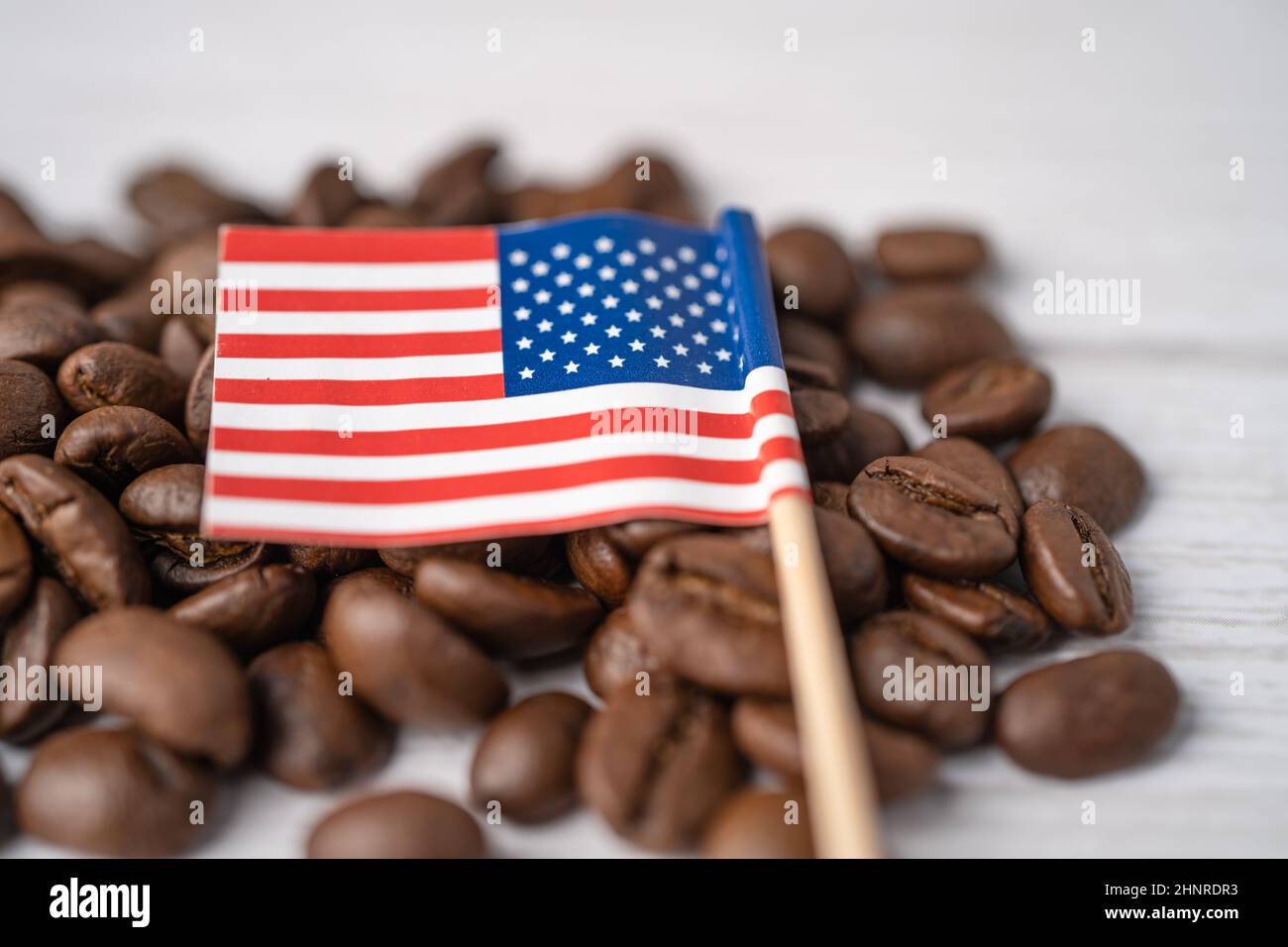 USA America flag on coffee beans; import export drink food concept. Stock Photo