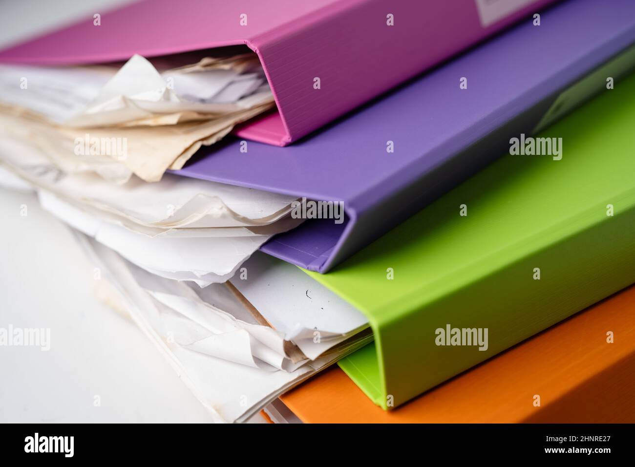 File Folder Binder stack of multi color on table in office. Stock Photo