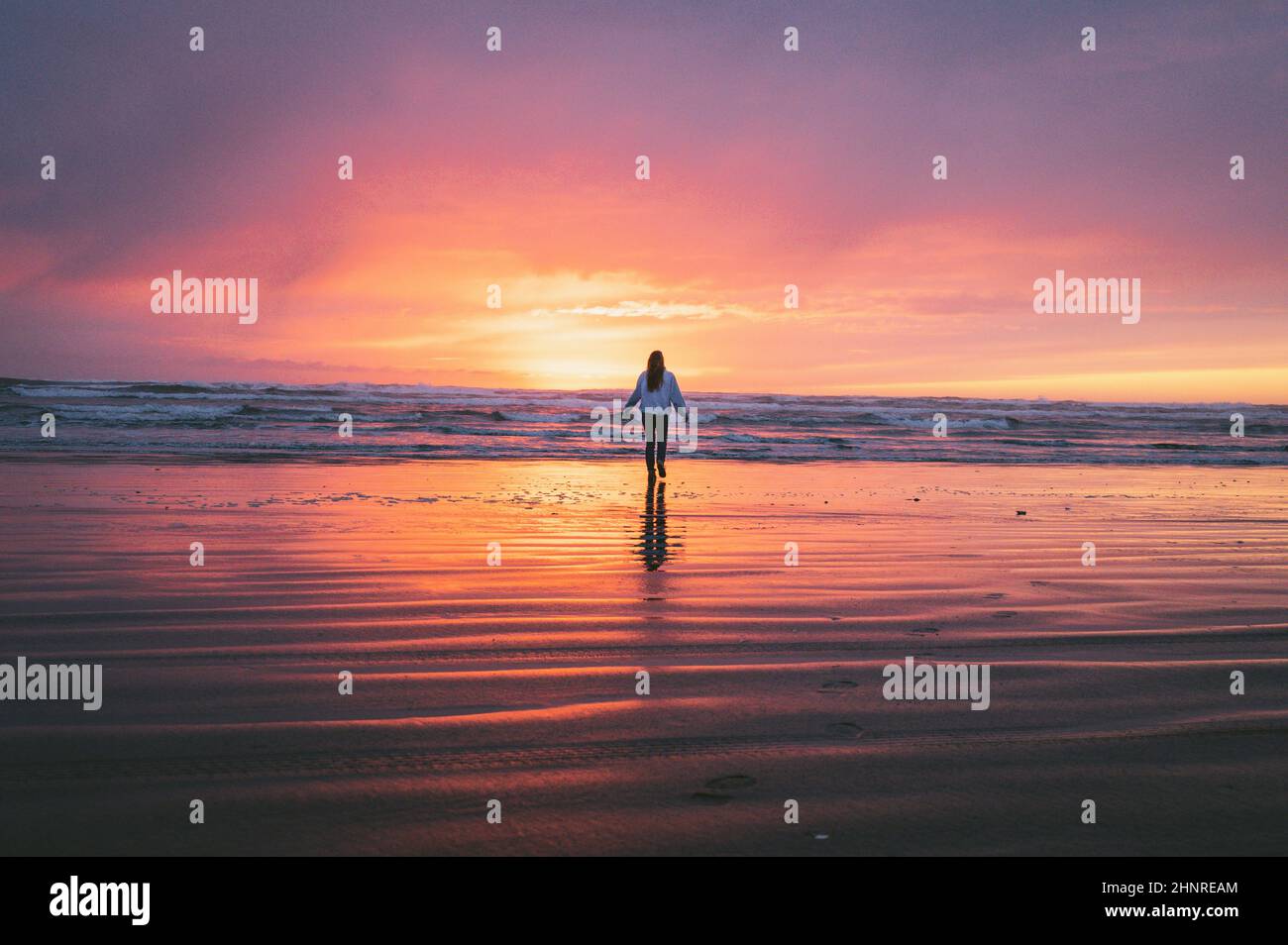 Female on the beach hi-res stock photography and images - Alamy