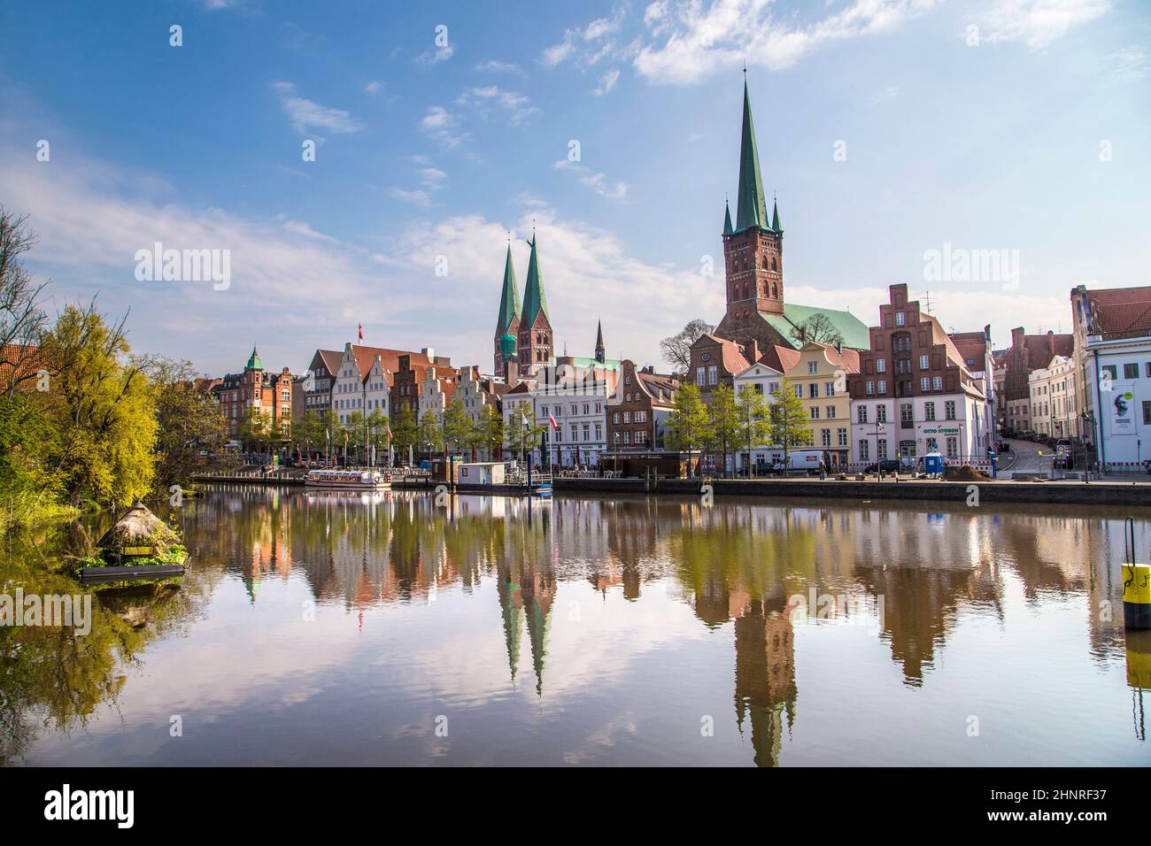 scenic view to skyline of Luebeck at river Trave Stock Photo